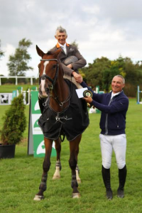 Taylor Presenting Francis with his winning rosette in the Mervue Equine LST 2016